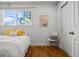 Bedroom with hardwood floors and ample sunlight at 3351 S Field St # 104, Lakewood, CO 80227