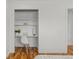 Close up of closet desk nook with hardwood floors at 3351 S Field St # 104, Lakewood, CO 80227