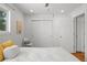 Bedroom featuring hardwood floors and a closet at 3351 S Field St # 104, Lakewood, CO 80227