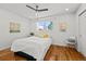 Bright bedroom with hardwood floors and ample sunlight and a cieling fan at 3351 S Field St # 104, Lakewood, CO 80227