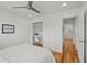 Comfortable bedroom with closet desk nook, hardwood floors, and ample hallway access at 3351 S Field St # 104, Lakewood, CO 80227
