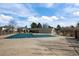 Community pool with a large fenced-in area and recreational space for residents to enjoy swimming at 3351 S Field St # 104, Lakewood, CO 80227