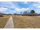 Expansive green space within the community with a sidewalk that connects residences at 3351 S Field St # 104, Lakewood, CO 80227