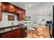 Open kitchen with granite countertops, stainless steel appliances, and hardwood floors at 3351 S Field St # 104, Lakewood, CO 80227