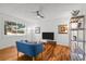 Cozy living room with hardwood floors, large window views, and stylish decor at 3351 S Field St # 104, Lakewood, CO 80227