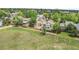 Aerial view of a neighborhood featuring well-maintained homes and fenced yards near an open field at 9669 Jellison Way, Broomfield, CO 80021