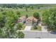 Aerial view of a two-story home featuring a well-maintained yard and a backdrop of lush greenery at 9669 Jellison Way, Broomfield, CO 80021