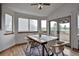 Bright dining room with hardwood floors and access to an outdoor patio at 9669 Jellison Way, Broomfield, CO 80021