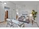 Bright living room with high ceilings, neutral walls, and modern furnishings at 9669 Jellison Way, Broomfield, CO 80021
