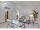 Bright living room with high ceilings, neutral walls, and modern furnishings at 9669 Jellison Way, Broomfield, CO 80021