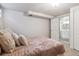 Basement bedroom next to door to the bathroom offering egress windows and a cozy atmosphere at 8625 W Dartmouth Pl, Lakewood, CO 80227