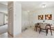 Bright dining area with tile flooring, a modern table, and stylish decor at 8625 W Dartmouth Pl, Lakewood, CO 80227