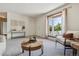 Cozy living room with a bay window, neutral tones, and comfortable seating at 8625 W Dartmouth Pl, Lakewood, CO 80227