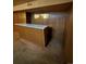 Basement bar area with wood paneling and white countertop at 440 Empire St, Aurora, CO 80010