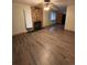 Living room features brick fireplace and laminate wood flooring at 440 Empire St, Aurora, CO 80010