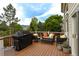 Spacious back deck with outdoor seating, perfect for entertaining, complete with a grill for summer cookouts at 14261 W Evans Cir, Lakewood, CO 80228