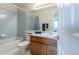 Cozy bathroom with a tub, and a wood vanity offering storage space at 14261 W Evans Cir, Lakewood, CO 80228