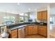 Kitchen with granite countertops, stainless steel appliances, and hardwood floors at 14261 W Evans Cir, Lakewood, CO 80228
