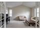 Bright sitting room with vaulted ceilings, carpet, and natural light from two windows at 14261 W Evans Cir, Lakewood, CO 80228