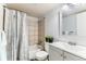 Updated bathroom featuring shower-tub combo and ample lighting at 10211 Ura Ln # 1-308, Thornton, CO 80260