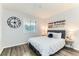 Bedroom featuring modern decor, window, and cozy furniture at 10211 Ura Ln # 1-308, Thornton, CO 80260