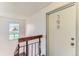 Hallway featuring stairwell, natural light, and unit 308 at 10211 Ura Ln # 1-308, Thornton, CO 80260