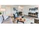 Comfortable living room with neutral colors, wood-look floors, and modern decor at 10211 Ura Ln # 1-308, Thornton, CO 80260