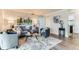 Cozy living room features modern furniture, neutral decor, and wood-look flooring for comfortable living at 10211 Ura Ln # 1-308, Thornton, CO 80260
