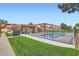 Community pool surrounded by well-kept buildings and green space at 10211 Ura Ln # 1-308, Thornton, CO 80260