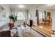 Inviting living room with large windows, neutral decor, and hardwood floors at 2281 Florence St, Aurora, CO 80010