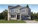 Two-story house with gray siding, stone accents, and a two-car garage at 545 Twilight St, Erie, CO 80516