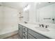 Bathroom features double sinks and shower-tub combo at 10303 E Peakview Ave # G203, Englewood, CO 80111