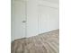 Bedroom featuring closets and hardwood floors at 10303 E Peakview Ave # G203, Englewood, CO 80111