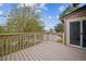 Inviting deck featuring wood-look plank flooring, offering seamless indoor-outdoor living with a sliding glass door at 10303 E Peakview Ave # G203, Englewood, CO 80111