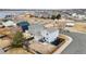 Aerial view of a neighborhood featuring well-maintained houses with fenced yards and community parks at 1212 Magpie Ave, Brighton, CO 80601