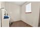 Simple bedroom featuring neutral walls, a window, and a vanity area at 1212 Magpie Ave, Brighton, CO 80601