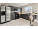 Modern kitchen featuring gray cabinets, stainless steel appliances, and ample counter space for cooking and entertaining at 1212 Magpie Ave, Brighton, CO 80601