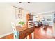 Warm dining area with a wooden table and chairs, seamlessly connected to a cozy living space at 2805 Jasmine St, Denver, CO 80207