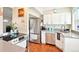 Well-equipped kitchen with stainless steel appliances, white cabinets, and modern countertops at 2805 Jasmine St, Denver, CO 80207