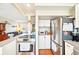 Modern kitchen featuring stainless steel appliances and seamless flow into the inviting living room at 2805 Jasmine St, Denver, CO 80207