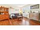 Comfortable living room showcasing hardwood floors, a cozy sofa, and natural light from a window at 2805 Jasmine St, Denver, CO 80207