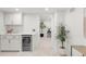 Stylish basement bar area complete with beverage fridge and quartz counters at 3361 W 36Th Ave, Denver, CO 80211