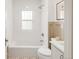 Bright bathroom with a tub and shower combination, mosaic tile, and a neutral palette at 3361 W 36Th Ave, Denver, CO 80211