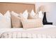 Close-up of a bedroom bed with neutral pillows and a cozy blanket adding warmth and comfort at 3361 W 36Th Ave, Denver, CO 80211