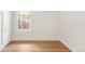 Bright room with hardwood floors and a window overlooking a tree-lined street at 3361 W 36Th Ave, Denver, CO 80211