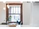Bright nook showcases a dark wood trim window, dining seating, and plant decor at 3361 W 36Th Ave, Denver, CO 80211