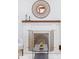 A decorative fireplace with a white mantel and ornate screen adds charm to the home at 3361 W 36Th Ave, Denver, CO 80211