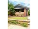Cozy home with a brick facade, green lawn, and quaint landscaping, offering curb appeal at 3361 W 36Th Ave, Denver, CO 80211