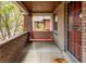Inviting front porch with a classic swing, offering a relaxing outdoor space at 3361 W 36Th Ave, Denver, CO 80211