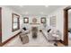 Sun-filled living room offers wood trim windows, decorative fireplace, and a stylish rug at 3361 W 36Th Ave, Denver, CO 80211